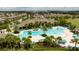 Resort-style pool with ample lounge chairs and palm trees at 16626 Point Rock Dr, Winter Garden, FL 34787