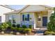 Single story home with a covered porch and well-maintained landscaping at 16626 Point Rock Dr, Winter Garden, FL 34787