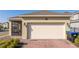 House exterior showing garage and screened patio at 16626 Point Rock Dr, Winter Garden, FL 34787