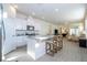 Open kitchen with island, granite countertops, and stainless steel appliances at 16626 Point Rock Dr, Winter Garden, FL 34787