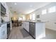 Open concept kitchen with island and view of dining area at 16626 Point Rock Dr, Winter Garden, FL 34787