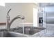 Modern kitchen sink and faucet with granite countertop at 16626 Point Rock Dr, Winter Garden, FL 34787