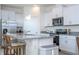 Kitchen with white cabinets, granite countertops, and stainless steel appliances at 16626 Point Rock Dr, Winter Garden, FL 34787