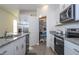Spacious kitchen with stainless steel appliances and granite countertops at 16626 Point Rock Dr, Winter Garden, FL 34787