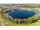 Large lake surrounded by trees and residential homes at 16626 Point Rock Dr, Winter Garden, FL 34787