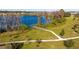 Walking path by the lake with a wooden footbridge at 16626 Point Rock Dr, Winter Garden, FL 34787