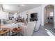 Bright and spacious living room with an open floor plan, comfortable seating, and a large TV at 16626 Point Rock Dr, Winter Garden, FL 34787