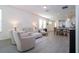 Open concept living and dining area with hardwood floors and ample natural light at 16626 Point Rock Dr, Winter Garden, FL 34787