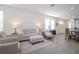 Living room with cozy seating arrangement and natural light at 16626 Point Rock Dr, Winter Garden, FL 34787