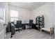 Home office with two desks, chairs, and built-in shelving at 16626 Point Rock Dr, Winter Garden, FL 34787