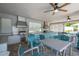 Community outdoor kitchen with grills and seating at 16626 Point Rock Dr, Winter Garden, FL 34787