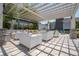 Relaxing pergola with comfortable seating and a beautiful setting at 16626 Point Rock Dr, Winter Garden, FL 34787