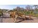 Wooden playground structure with slide and climbing features at 16626 Point Rock Dr, Winter Garden, FL 34787