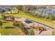 Community playground with play structures near a lake at 16626 Point Rock Dr, Winter Garden, FL 34787