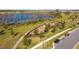 Community playground with play structures near a lake at 16626 Point Rock Dr, Winter Garden, FL 34787