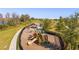 Community playground with play structures and walking path at 16626 Point Rock Dr, Winter Garden, FL 34787