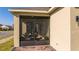 Screened patio with seating area adjacent to house at 16626 Point Rock Dr, Winter Garden, FL 34787