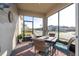 Relaxing screened porch with patio furniture and view of neighborhood at 16626 Point Rock Dr, Winter Garden, FL 34787