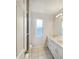Clean bathroom with double vanity and tile floors at 1878 Algonquin Ave, Deltona, FL 32725