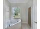 Relaxing bathroom featuring a corner jacuzzi tub at 1878 Algonquin Ave, Deltona, FL 32725
