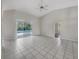 Bright Gathering room with tile floors, sliding glass doors to pool, and vaulted ceiling at 1878 Algonquin Ave, Deltona, FL 32725