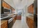 Kitchen with stainless steel appliances and wood cabinets at 1878 Algonquin Ave, Deltona, FL 32725
