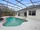 Freeform pool with a covered patio and screened enclosure at 1878 Algonquin Ave, Deltona, FL 32725