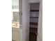 Linen closet with wooden shelves in the bathroom at 1902 Honour Rd # 9, Orlando, FL 32839