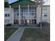 Front view of condo building showcasing its architectural details at 1902 Honour Rd # 9, Orlando, FL 32839
