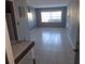 Bright living room featuring tile floors and large window at 1902 Honour Rd # 9, Orlando, FL 32839