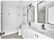 This bathroom features a dual sink vanity with modern fixtures and a framed mirror at 1932 Lake Atriums Cir # 69, Orlando, FL 32839