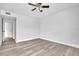This bedroom features wood-look flooring, a ceiling fan, and is ready for you to make it your own at 1932 Lake Atriums Cir # 69, Orlando, FL 32839