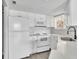 Bright kitchen with white cabinets, modern appliances, and updated countertops at 1932 Lake Atriums Cir # 69, Orlando, FL 32839