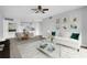 Living room featuring modern decor, ceiling fan, access to kitchen, stylish furniture, and neutral color palette at 1932 Lake Atriums Cir # 69, Orlando, FL 32839