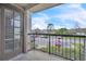 Outdoor patio with railing overlooking a parking lot and neighborhood at 1932 Lake Atriums Cir # 69, Orlando, FL 32839