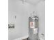 A standard water heater in a utility closet at 1932 Lake Atriums Cir # 69, Orlando, FL 32839