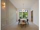 Elegant dining room featuring a large window and modern light fixture at 210 E Lake Sue Ave, Winter Park, FL 32789