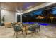 Outdoor dining area with glass table and chairs near the pool at 210 E Lake Sue Ave, Winter Park, FL 32789