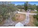 Aerial view showing home and a large, circular driveway at 31316 Saunders Dr, Tavares, FL 32778