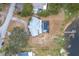 Aerial view of house, pool, dock, and waterfront property at 31316 Saunders Dr, Tavares, FL 32778