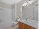 Clean bathroom with single vanity, shower and tub at 3362 Robert Trent Jones Dr # 30307, Orlando, FL 32835