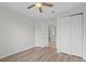 Bright bedroom with wood-look floors and double closet at 3362 Robert Trent Jones Dr # 30307, Orlando, FL 32835