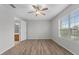 Bedroom with hardwood floors and access to bathroom at 3362 Robert Trent Jones Dr # 30307, Orlando, FL 32835