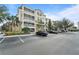 Condo building with parking lot and landscaping at 3362 Robert Trent Jones Dr # 30307, Orlando, FL 32835
