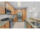 Kitchen with granite countertops and stainless steel appliances at 3362 Robert Trent Jones Dr # 30307, Orlando, FL 32835