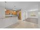 Kitchen with island, stainless steel appliances, and wood cabinets at 3362 Robert Trent Jones Dr # 30307, Orlando, FL 32835