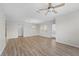 Large living room featuring hardwood floors and access to balcony at 3362 Robert Trent Jones Dr # 30307, Orlando, FL 32835