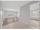 Open living area with hardwood floors and access to balcony at 3362 Robert Trent Jones Dr # 30307, Orlando, FL 32835