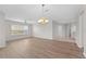 Bright living room with hardwood floors and a chandelier at 3362 Robert Trent Jones Dr # 30307, Orlando, FL 32835