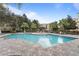 Inviting community pool with surrounding patio and landscaping at 3362 Robert Trent Jones Dr # 30307, Orlando, FL 32835